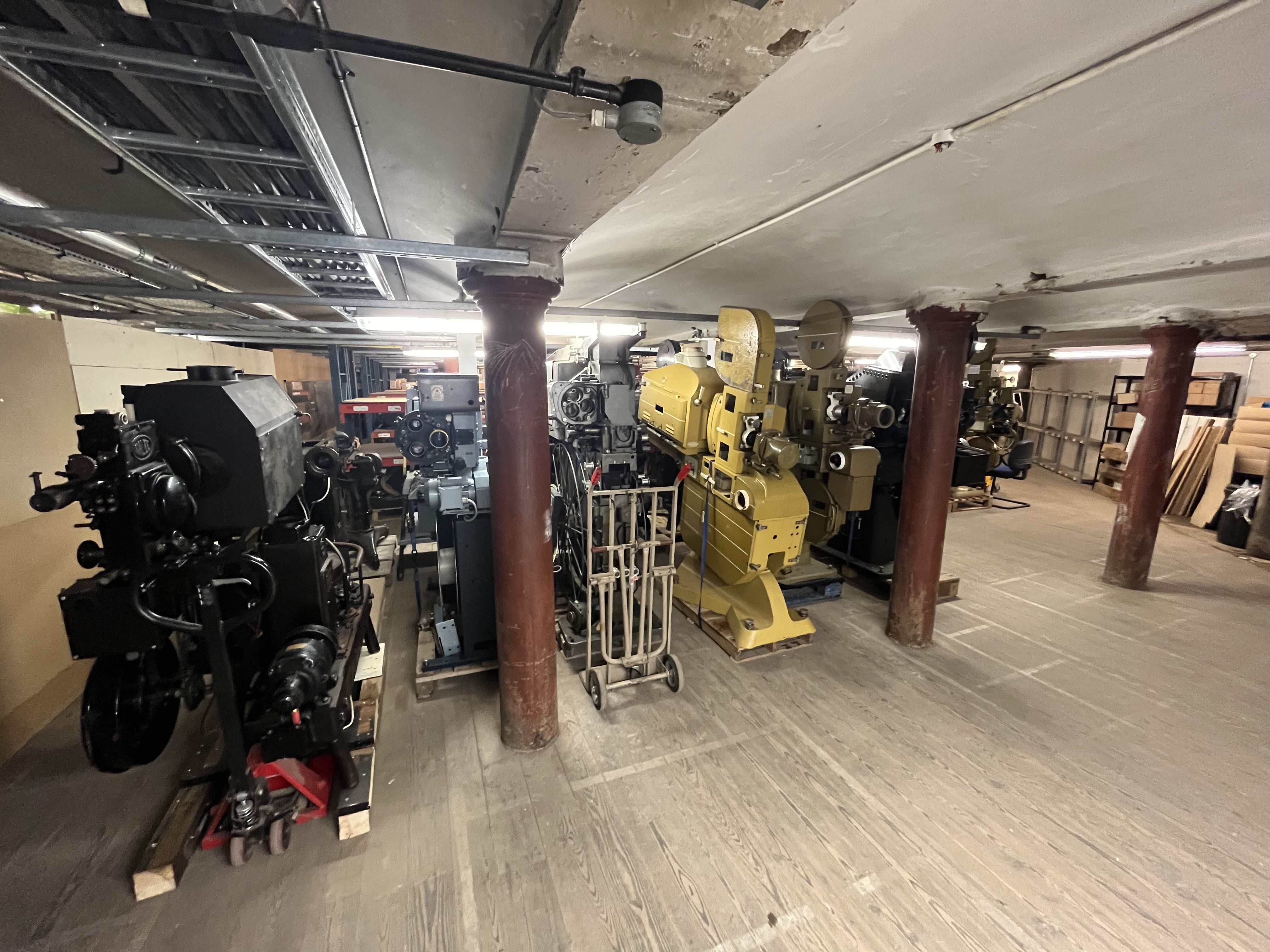 A basement storage area, now full of projectors and other cinema equipment.