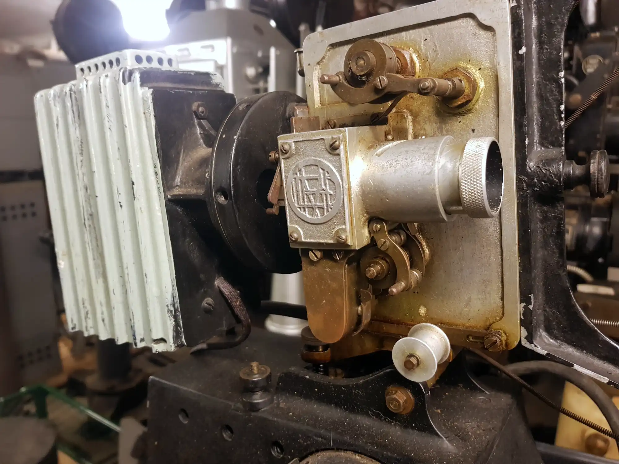A black and silver film projector showing some rust
