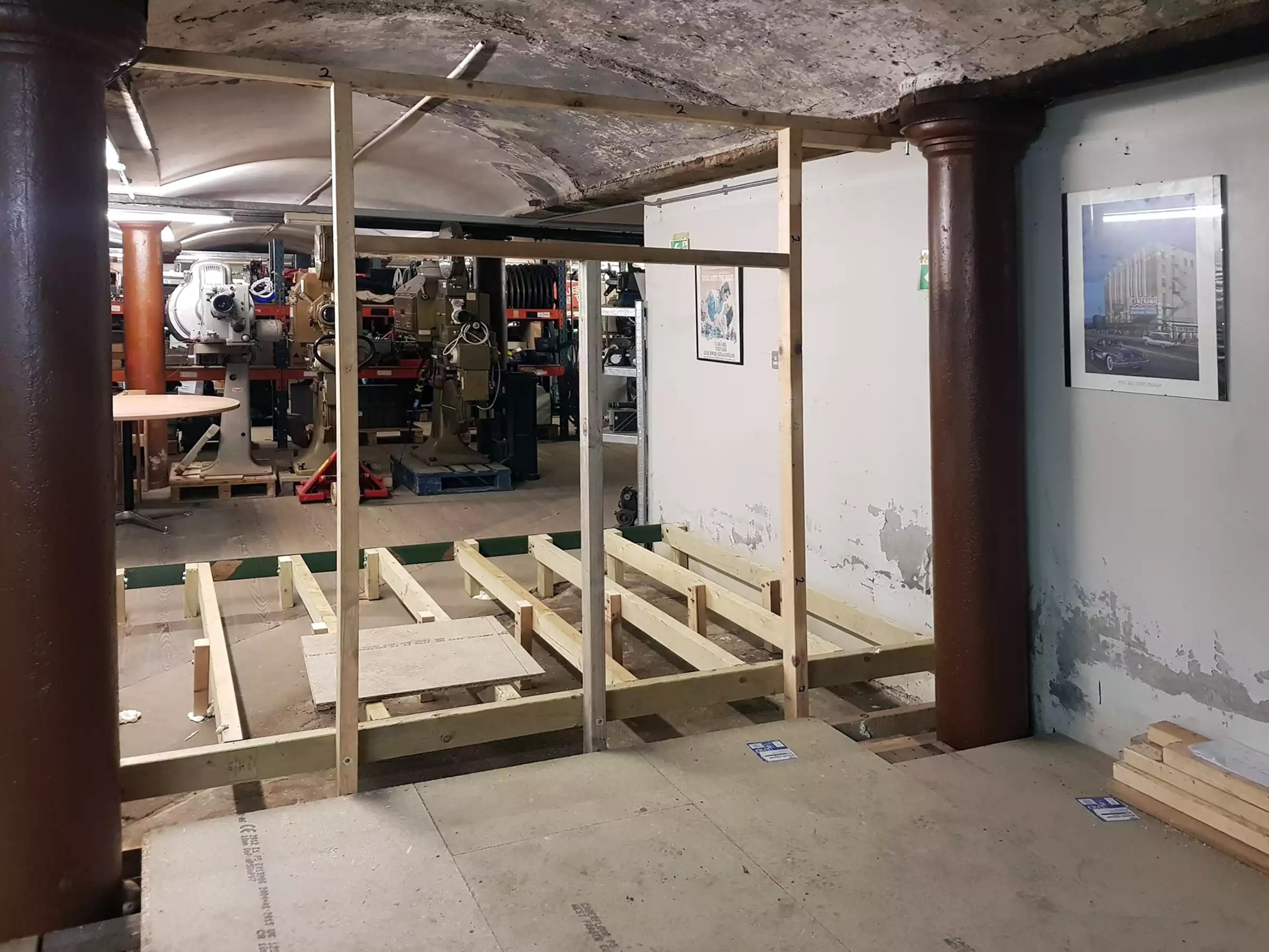 Floor joists completed, viewed from the other side of a stud wall