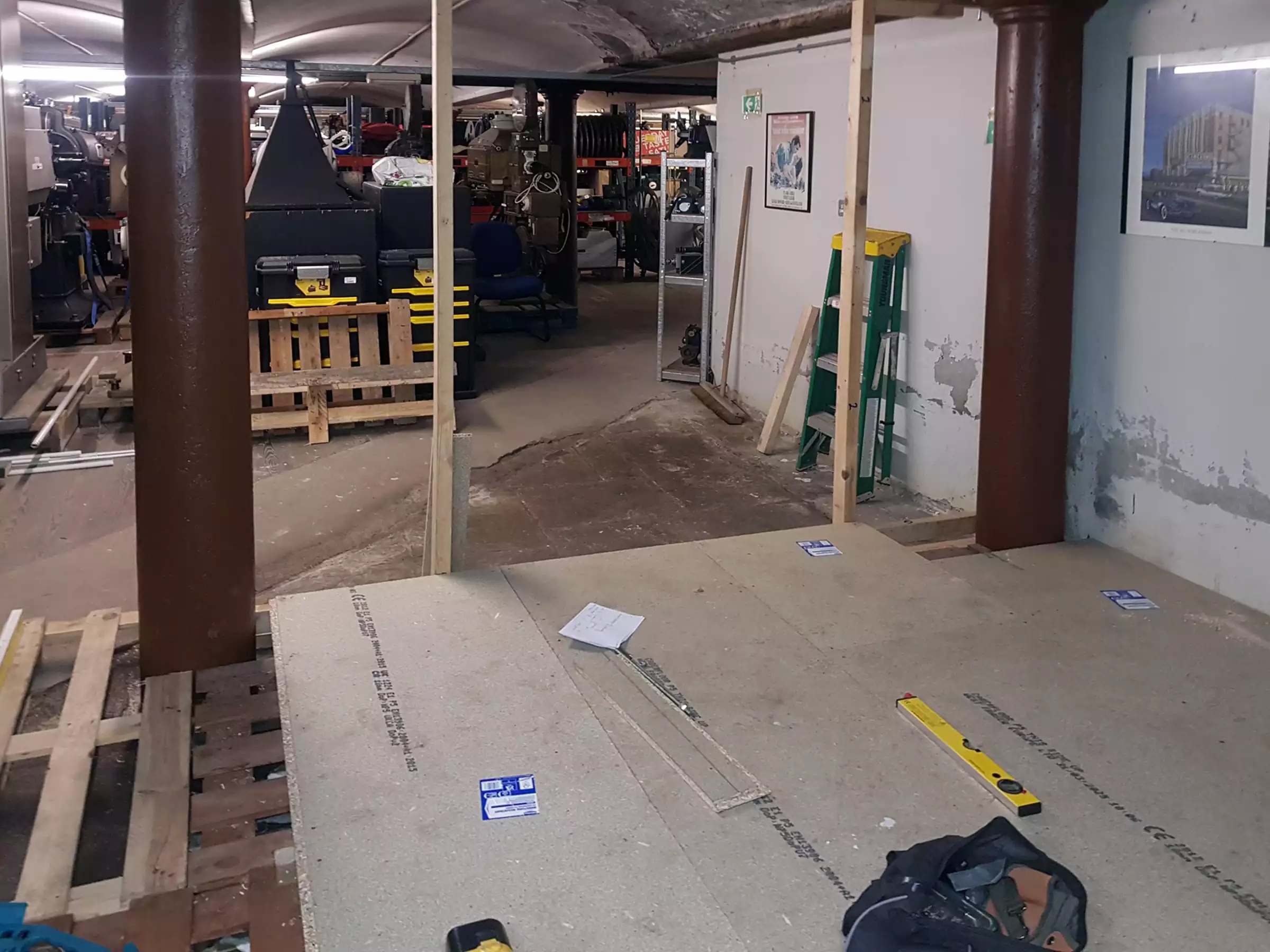 A basement area with the beginnings of a stud wall being constructed.